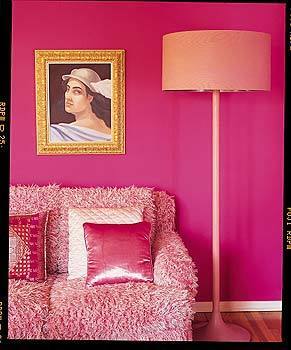 A painting of the Greek god Hermes by Margot Balanos hangs above a hand-me-down shag sofa that Love inherited from her mother.