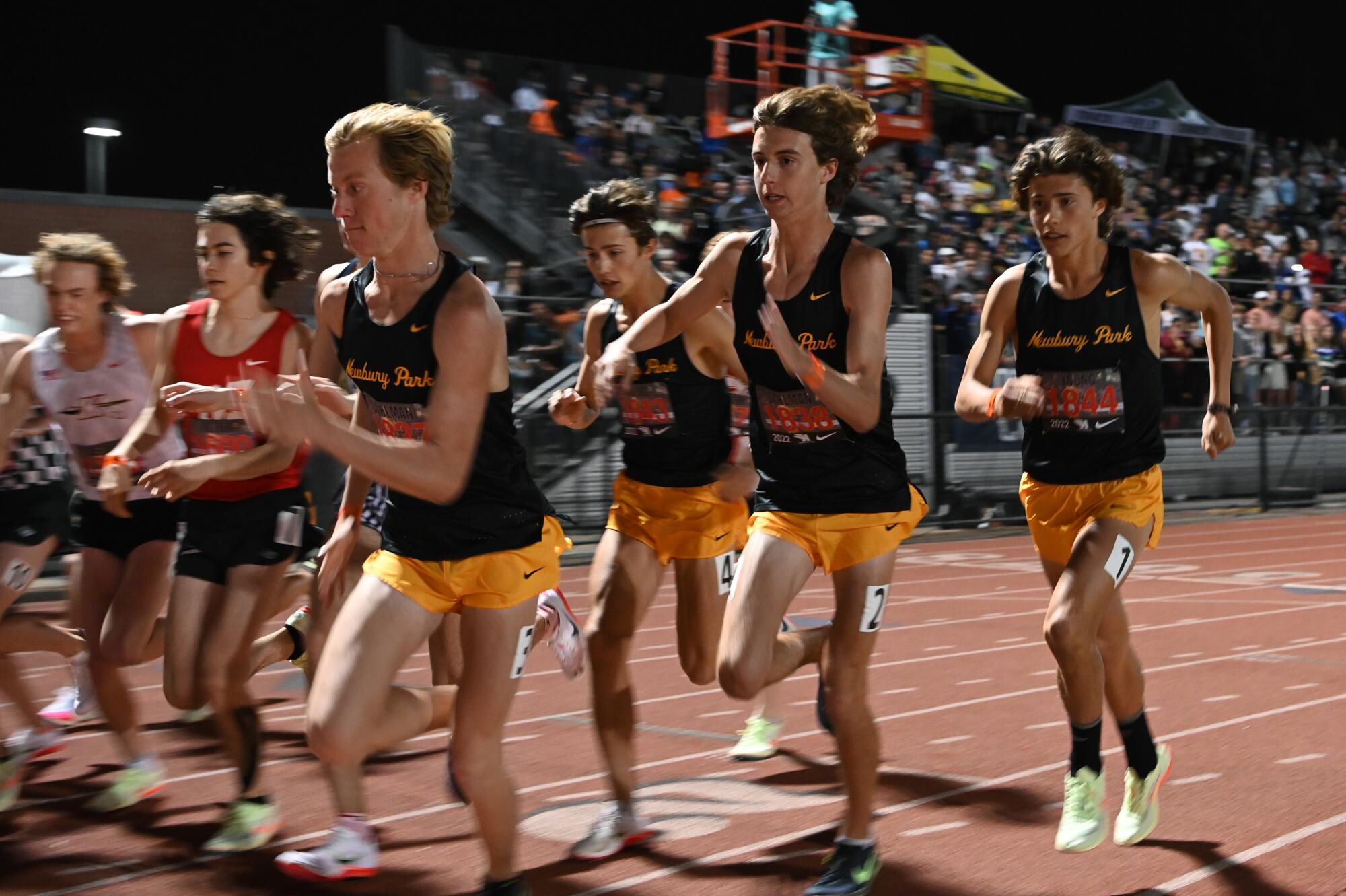 Newbury Park's Aaron Sahlman, Leo Young, Colin Sahlman and Lex Young, from left, start the boys' 3200 meter run 