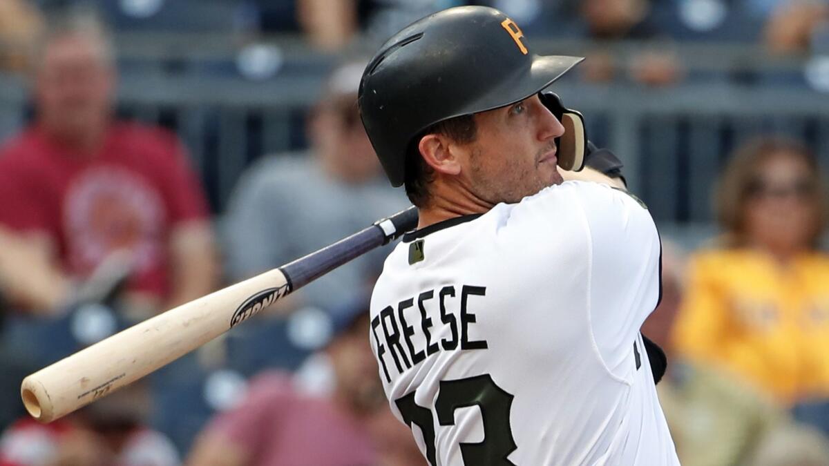 Pittsburgh Pirates' David Freese watches his two-run home run off New York Mets starting pitcher Steven Matz.