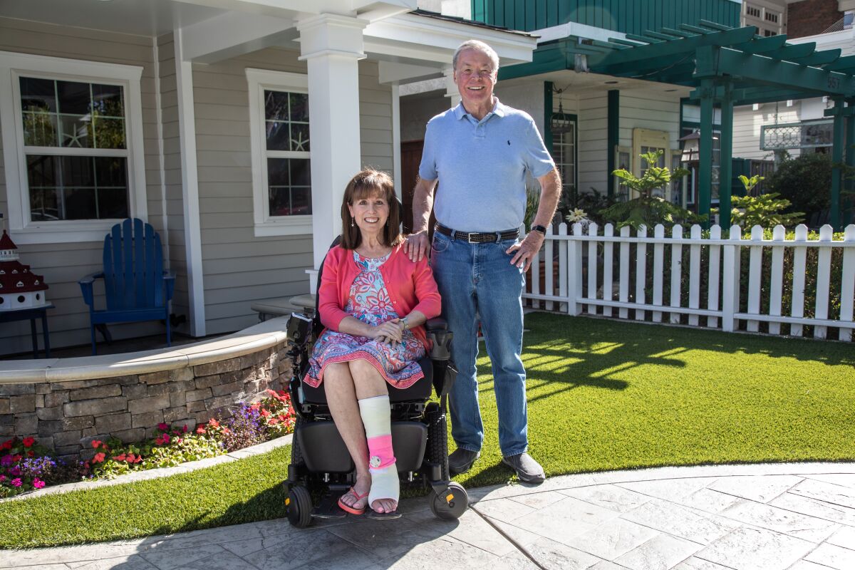 Jean Landon and her husband Dave Landon pose outside their home in Coronado. Jean has ALS.
