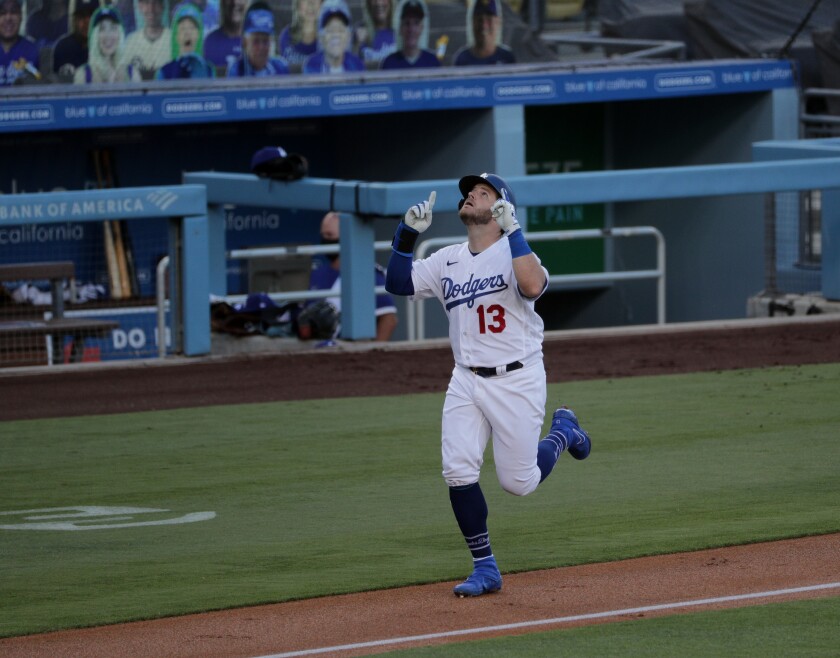 The Dodgers' Max Muncy reacts after hitting a first-inning home run July 24, 2020.