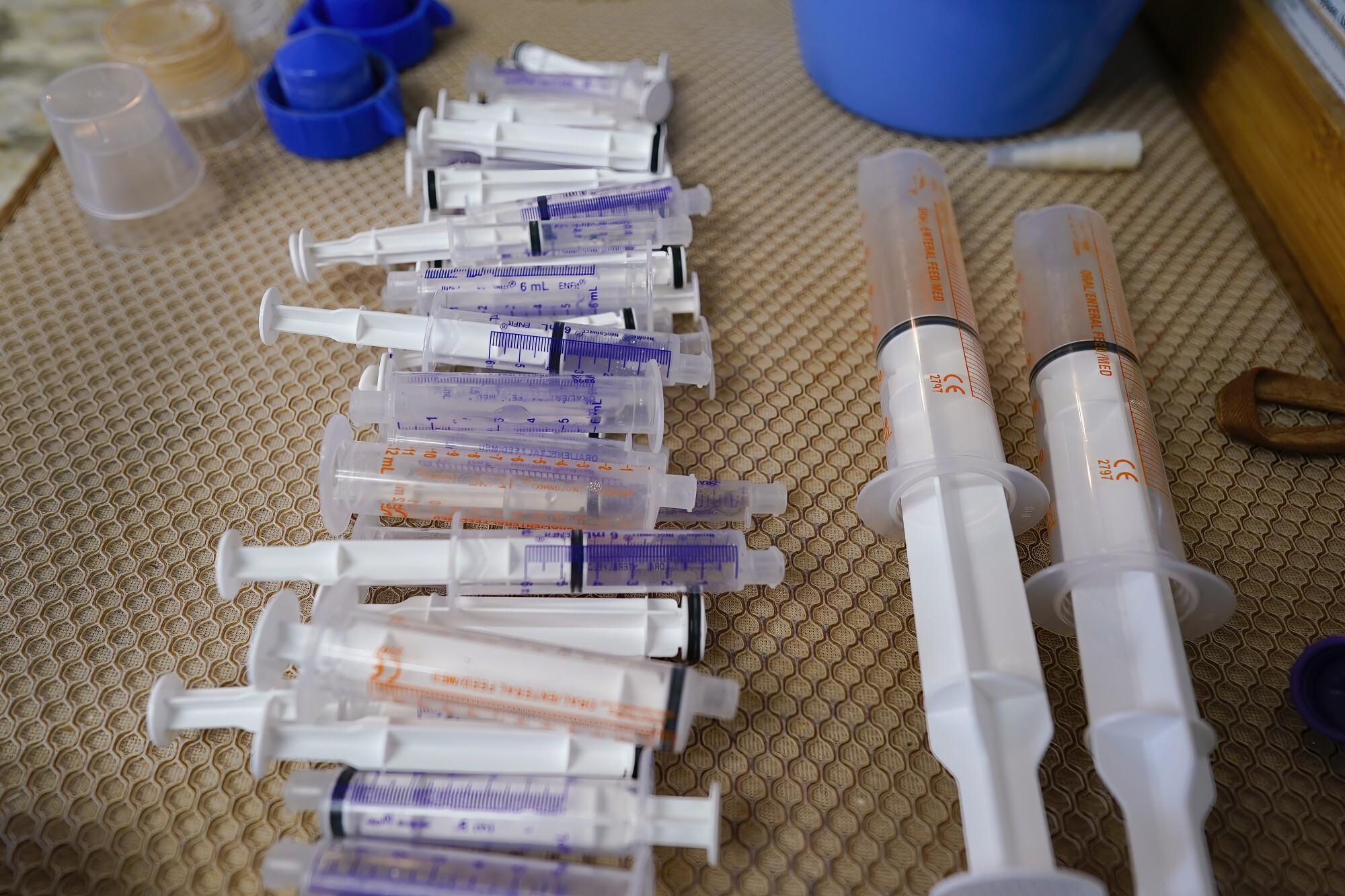 Feeding syringes for Samuel are stacked for immediate use.