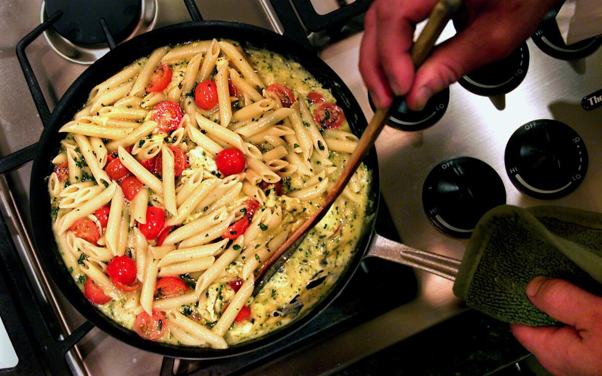 Pasta frittata with cherry tomatoes and fresh herbs