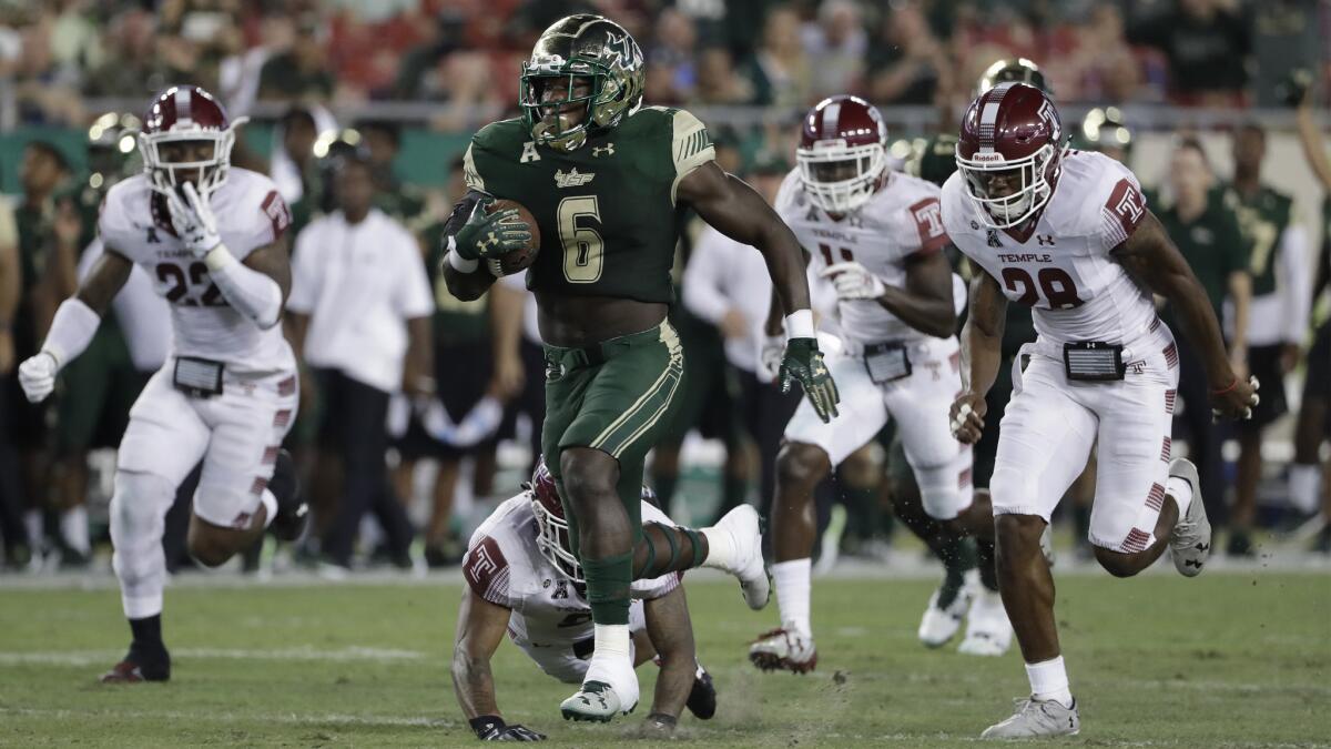 South Florida running back Darius Tice runs for a 47-yard touchdown against Temple during the first half on Thursday night.
