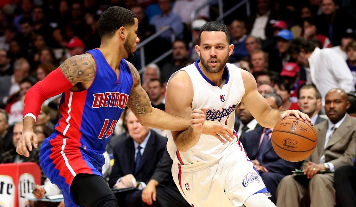 Clippers point guard Jordan Farmar drives against Pistons point guard D.J. Augistin during a 113-91 victory on Dec. 15.