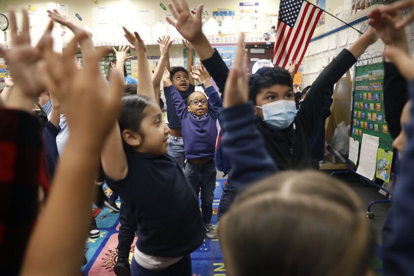 LONG BEACH-CA-MAY 1, 2023: Transitional kindergarten students including Lennox Cardea, center, do a stretching exercise at Oropeza Elementary School in Long Beach on May 1, 2023. (Christina House / Los Angeles Times)