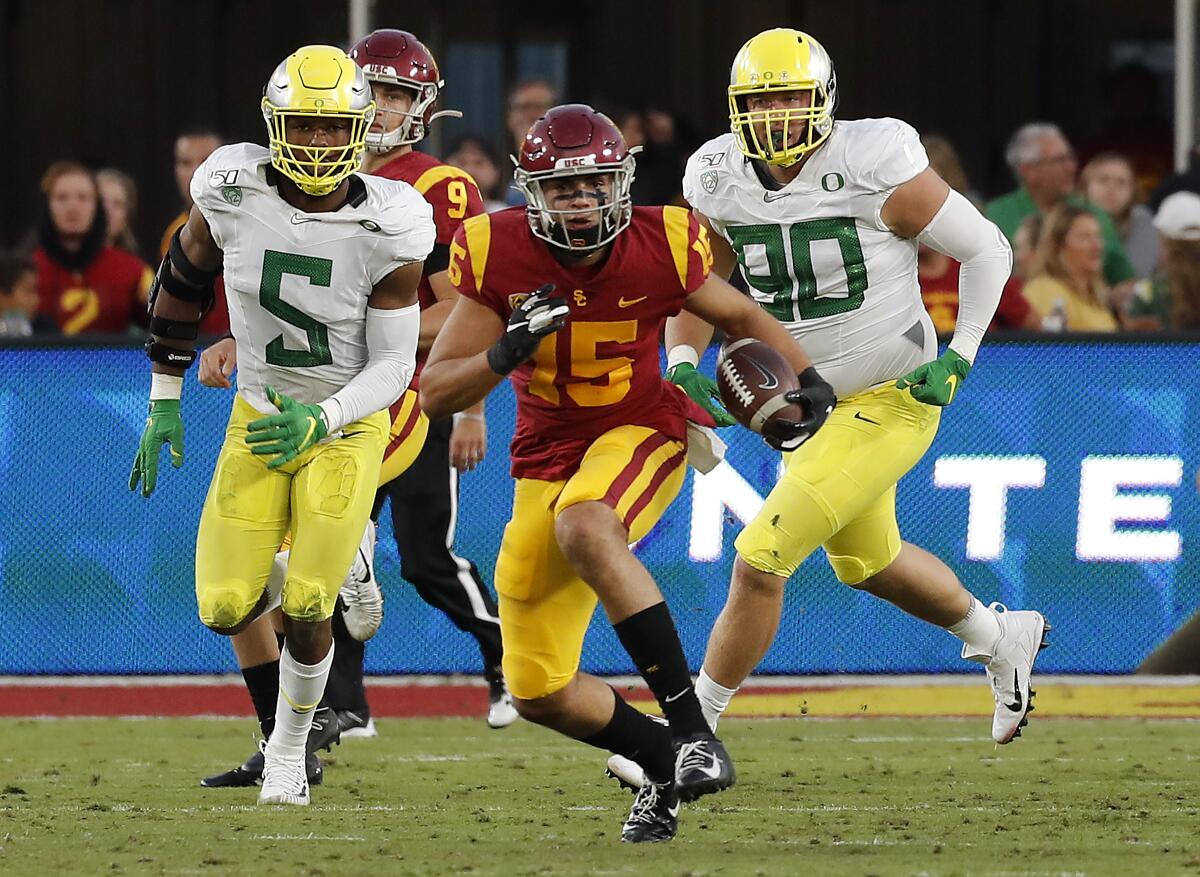 USC wide receiver Drake London looks for extra yardage after making a catch against Oregon.