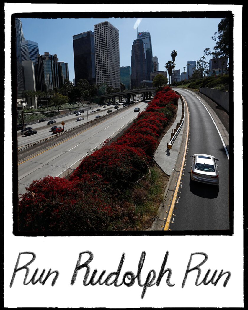 An illustration resembles a Polaroid photo of LA skyscrapers, little traffic on 110, and the words