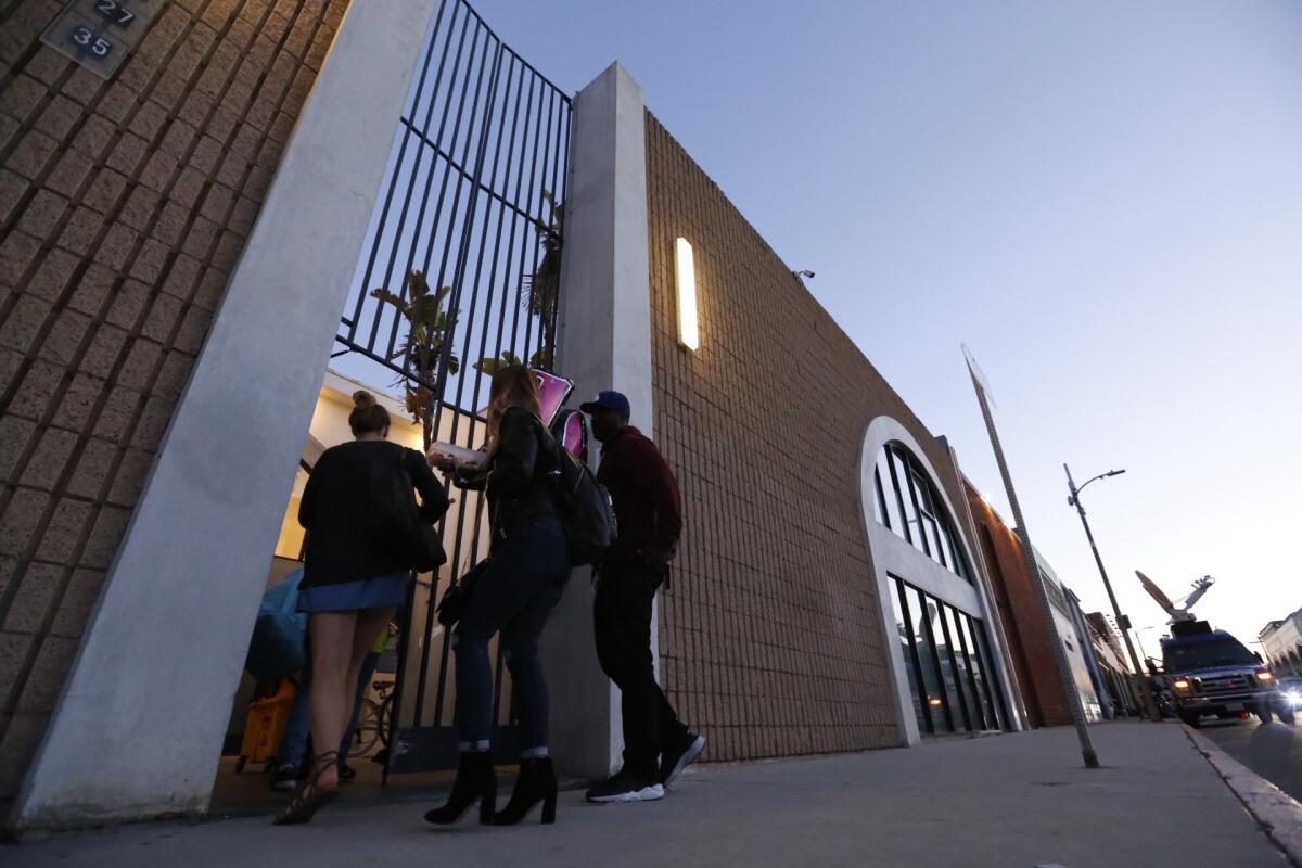 Employees of Snap enter one of several Snap buildings along Market Street in Venice.