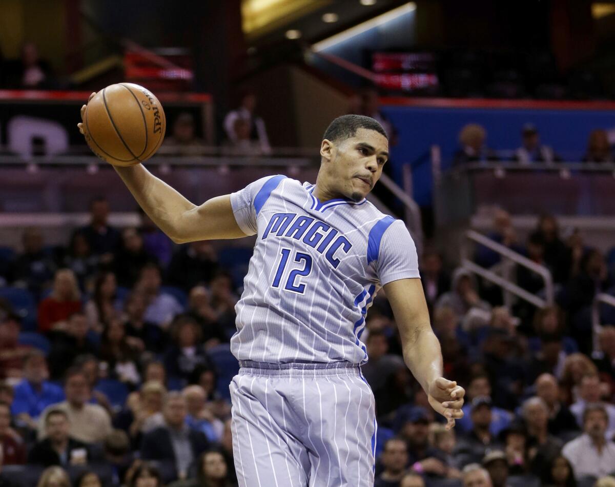 Magic forward Tobias Harris (12) grabs a rebound against the Clippers during the first half of a game on Feb. 5.