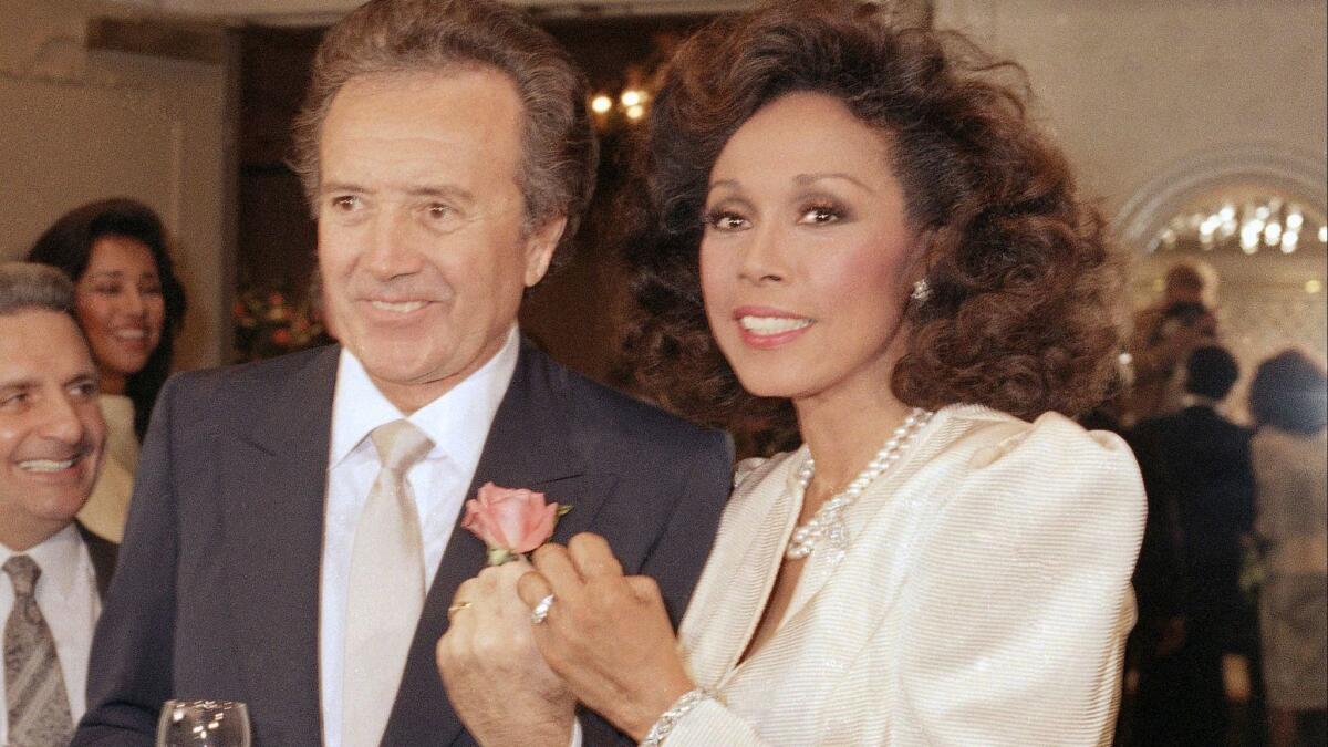Vic Damone and actress Diahann Carroll show off their rings after their wedding in Atlantic City, N,J., in 1987. The two later divorced.