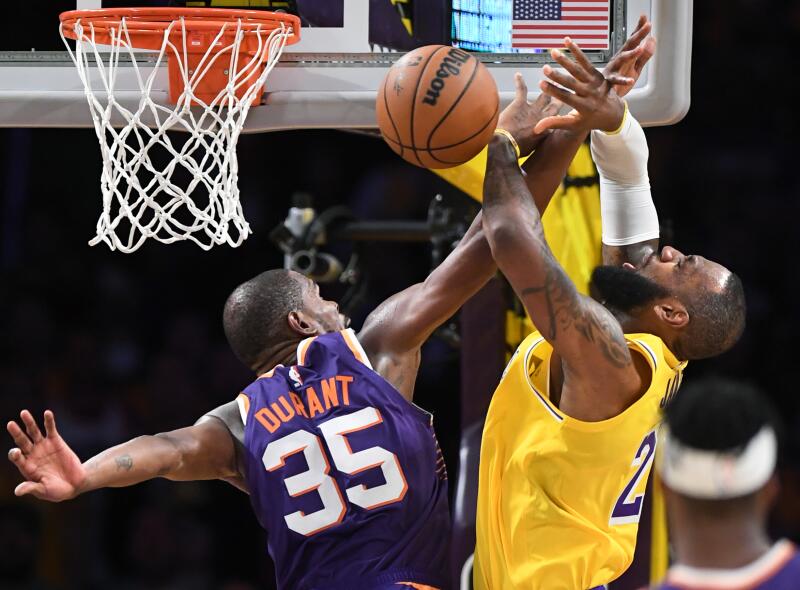LeBron James is fouled by Suns star Kevin Durant in the fourth quarter.