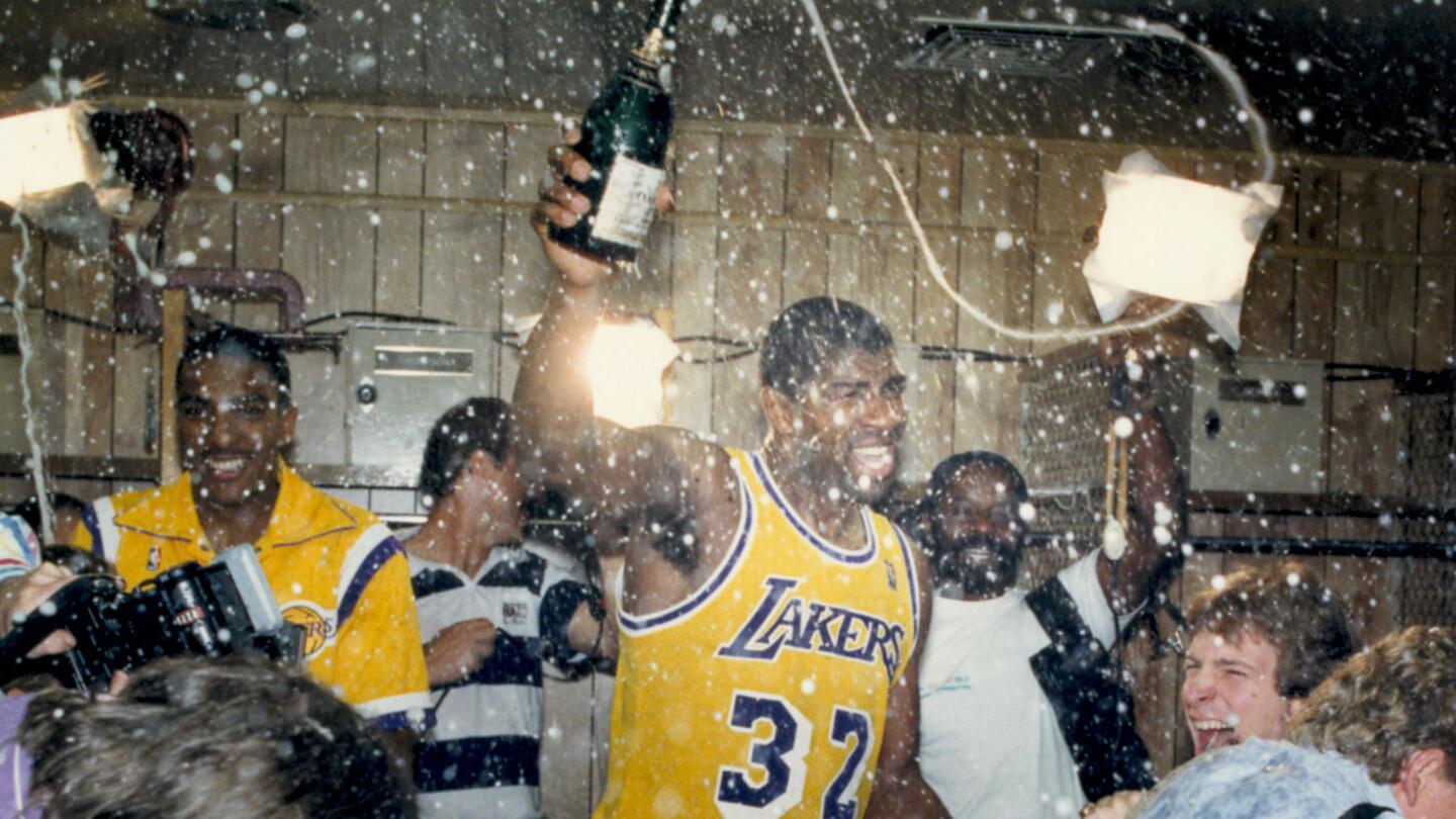 Johnson and the Lakers celebrate another NBA championship at the Forum after defeating Boston in six games in 1987.