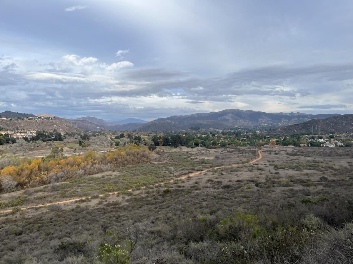 A view from the Par 4 Trail as it travels along the hillside overlooking nearby neighborhoods.