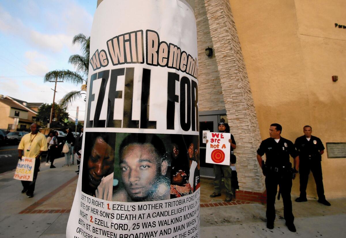 A flier bearing the likeness of Ezell Ford, who was shot to death by LAPD officers on Aug. 11, hangs on a lightpost outside Paradise Baptist Church in South Los Angeles.