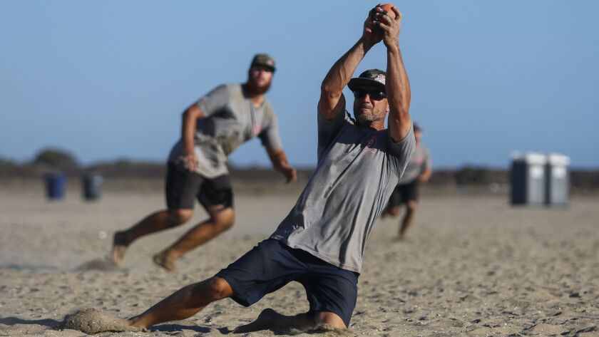 Valley Farm's Mike Ham makes a diving catch in the men's open division title game of the 65th Old Mission Beach Athletic Club Over-the-Line World Championship.