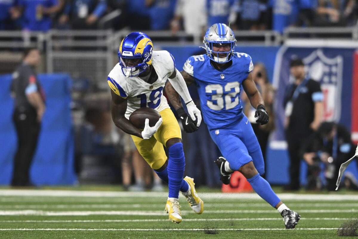 The Rams' Tyler Johnson (18) runs away from Lions safety Brian Branch (32) for a 63-yard reception.