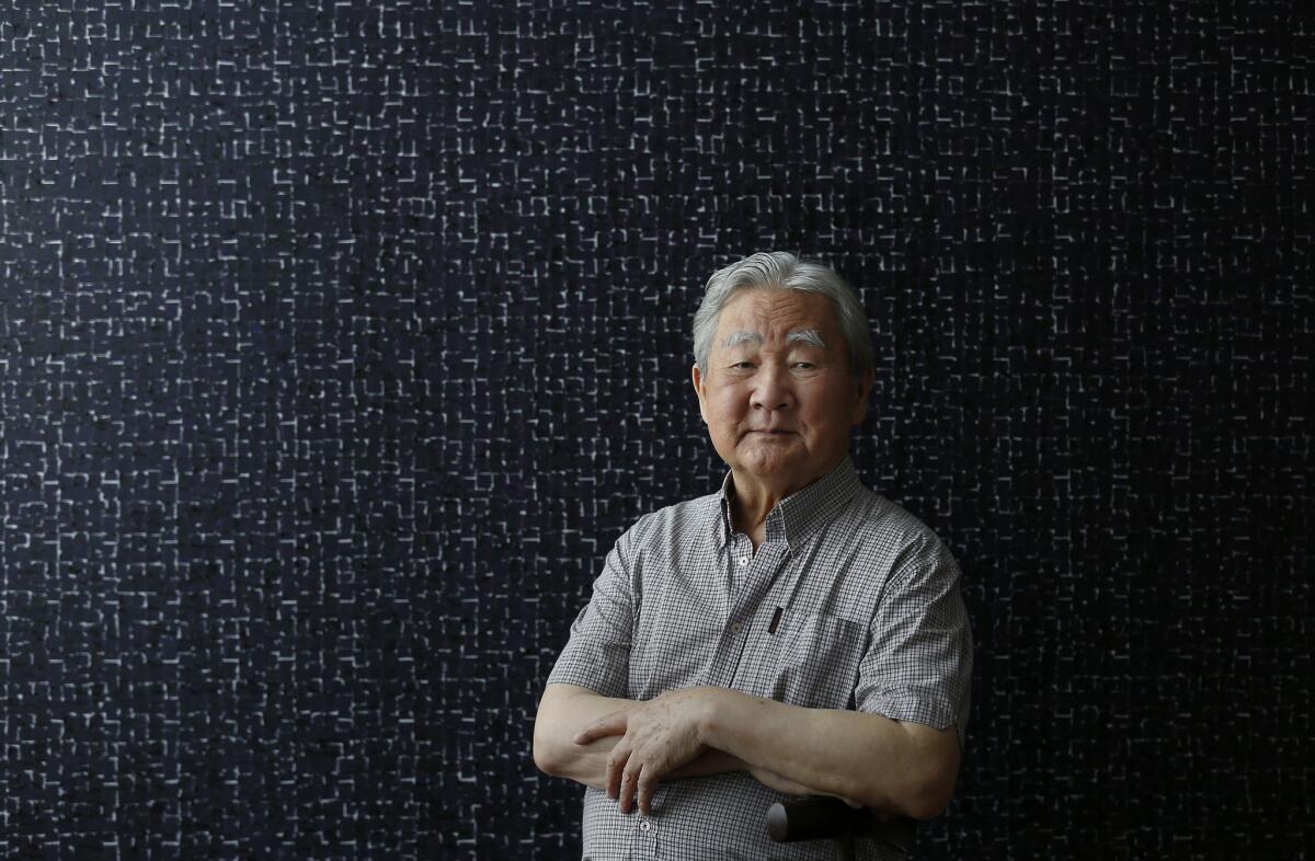 Portrait of artist Young-il Ahn in his home in downtown Los Angeles. At 83, Ahn still spends most of his working hours painting canvases large and small in his studio.