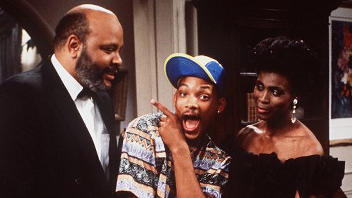 Uncle Phil (James Avery) and Aunt Viv (Janet Hubert) surround Will (Will Smith) on the "Fresh Prince of Bel-Air."