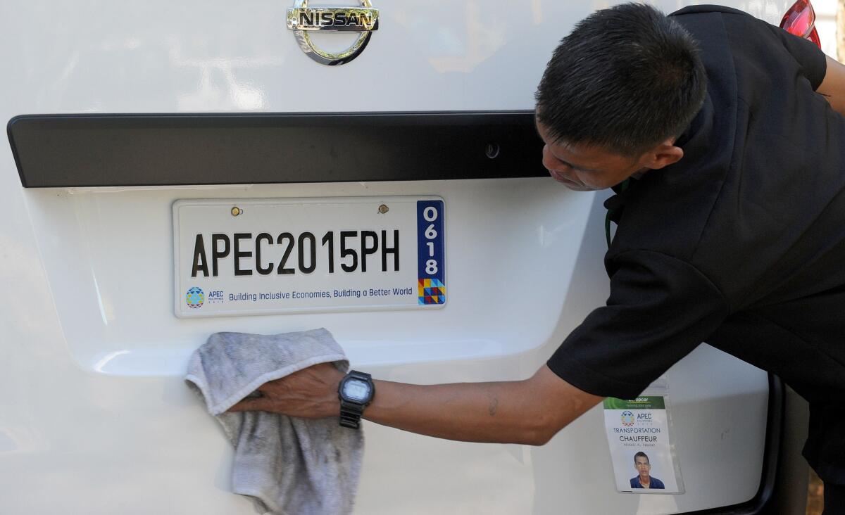 One of many new cars that will be used during the Asia-Pacific Economic Cooperation summit in the Philippines this month is polished in Manila on Nov. 8. President Obama and other world leaders are due to attend the summit.