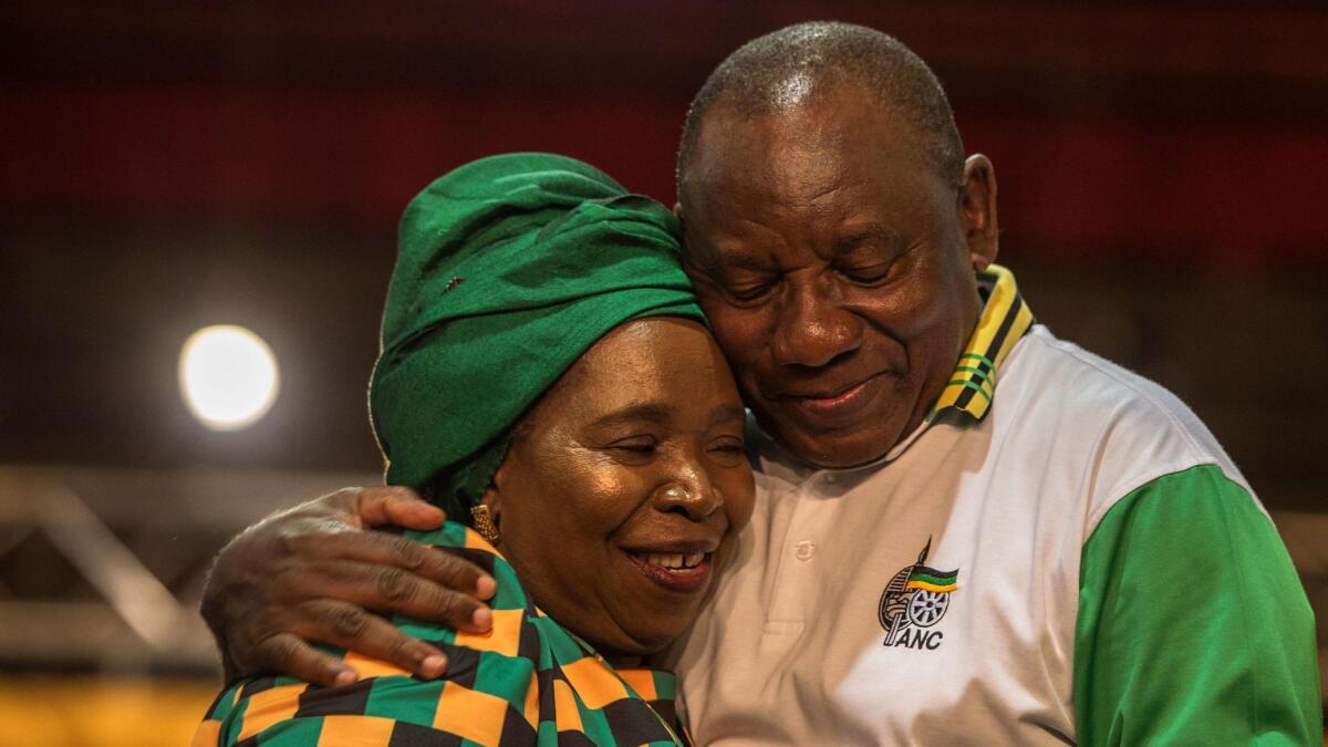 Newly elected African National Congress President and current South African Deputy President Cyril Ramaphosa is congratulated by Nkosazana Dlamini-Zuma at the 54th ANC conference on Monday.