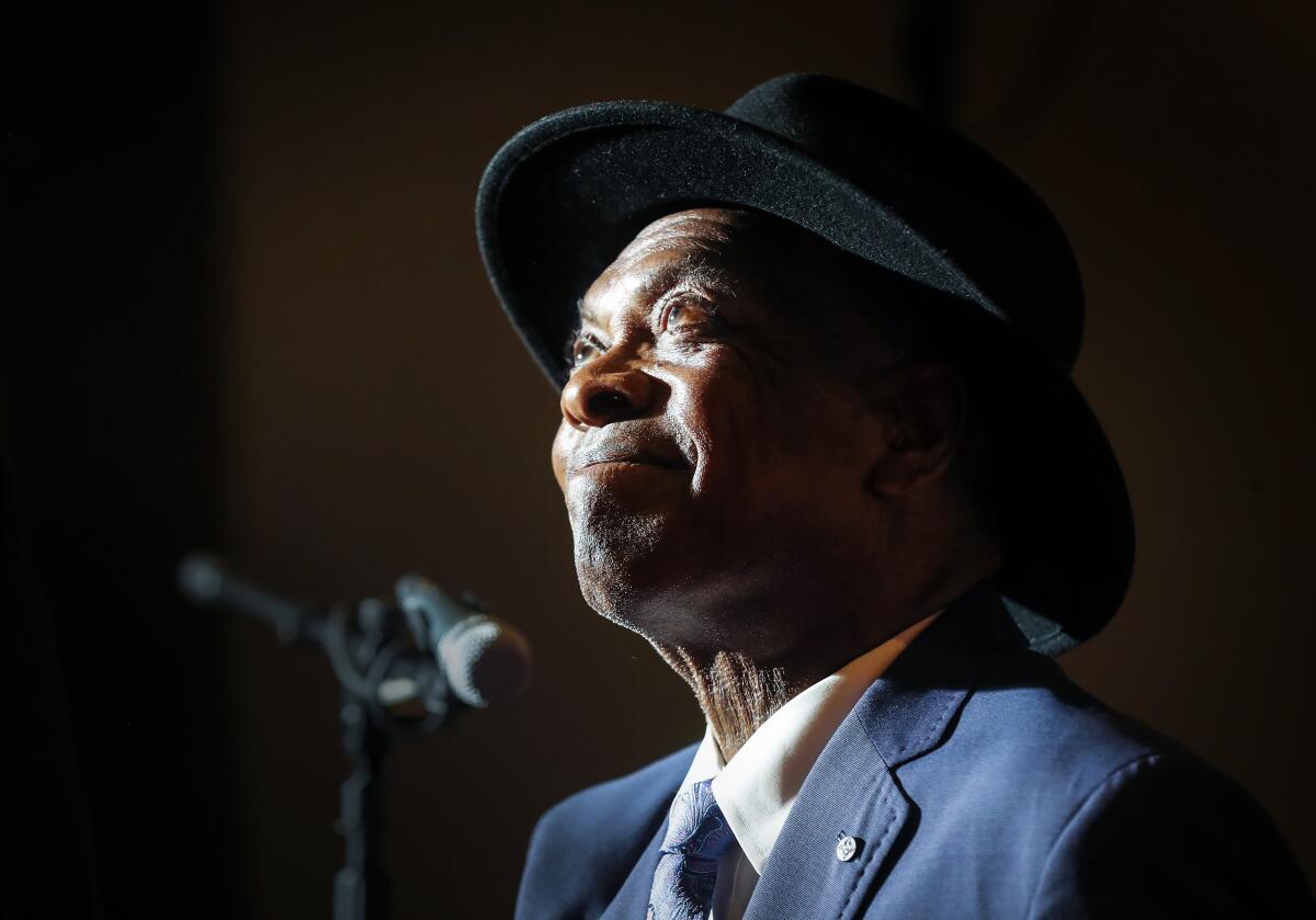 Booker T. Jones looks up and smiles inside the Stax Museum's "Studio A" on Wednesday, Sept. 14, 2022 in Memphis. A performance by the master keyboardist highlighted an announcement by the Stax Museum of American Soul Museum of events centered on the museum’s 20th anniversary next year in Memphis, Tennessee. Jones’ was followed by a video spotlighting events scheduled throughout 2023 to celebrate the museum’s birth two decades ago at the site of the former Stax Records. (Mark Weber/Daily Memphian via AP)
