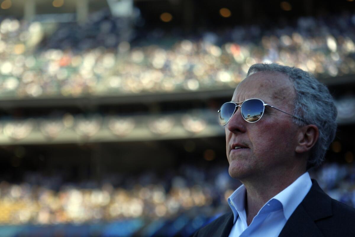 Then-Dodgers owner Frank McCourt surveys the scene at Dodger Stadium in 2011, perhaps envisioning a time in the future that an NFL team would play on the same site.