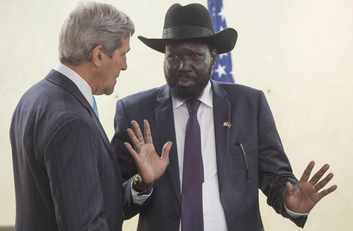 South Sudan's President Salva Kiir, right, chats with U.S. Secretary of State John F. Kerry at the president's office in Juba, South Sudan, on Friday.