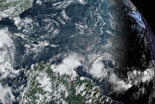 This National Oceanic and Atmospheric Administration satellite image taken at 4:20pm EDT shows hurricane Beryl, lower center right, as it strengthens over the Atlantic Ocean and churns toward the southeast Caribbean on Saturday, June 29, 2024. (NOAA via AP)