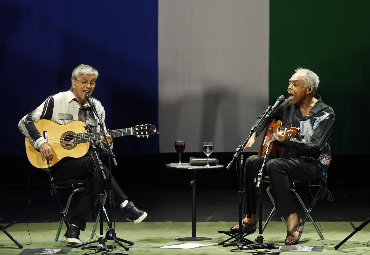 Caetano Veloso, left, and Gilberto Gil perform Sunday night at the Microsoft Theater in Los Angeles.