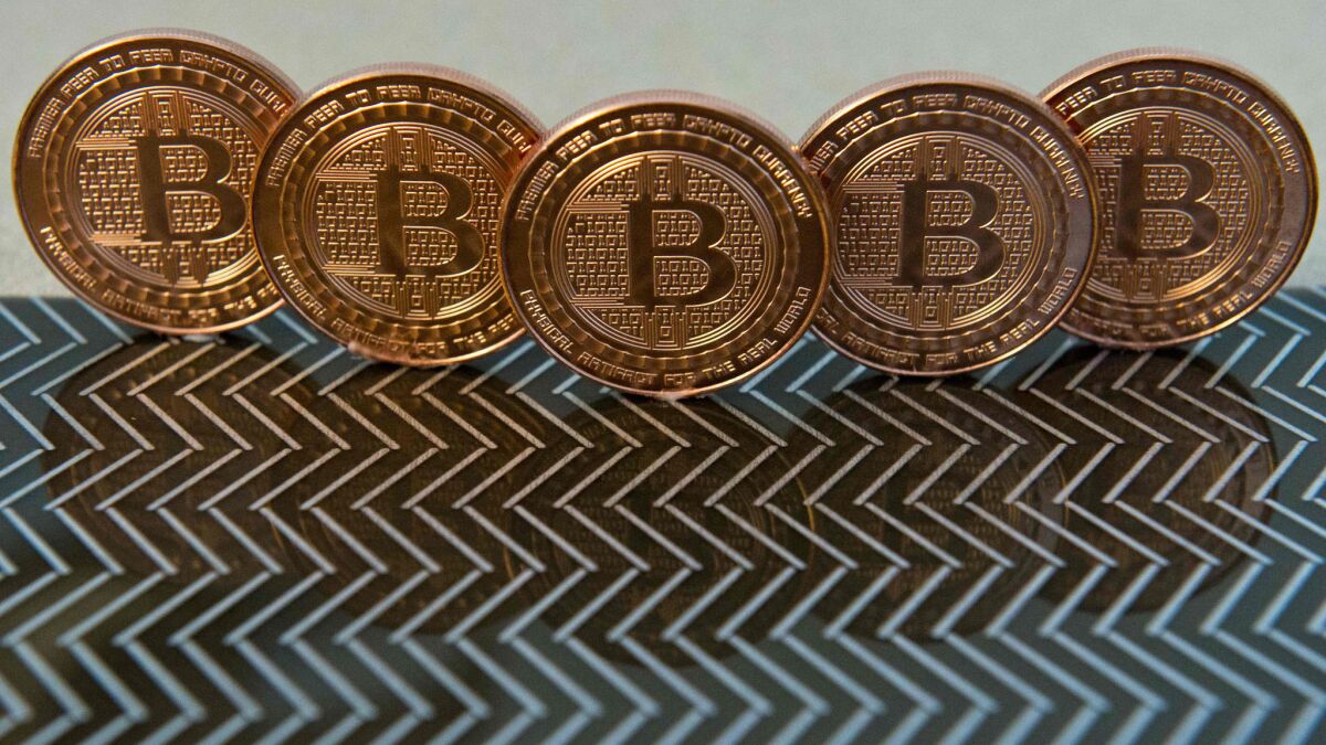 Bitcoin medals shown in a file photo taken June 17, 2014.
