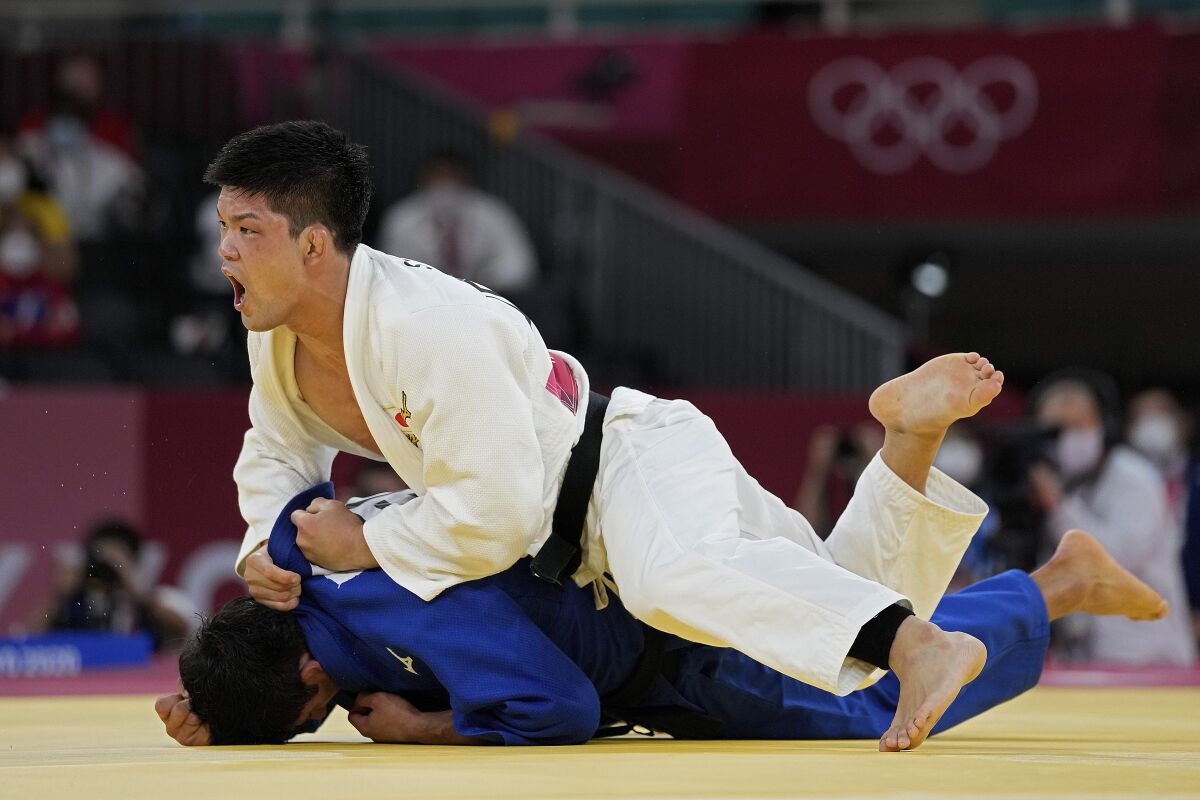 Japan's Shohei Ono of Japan competes with Lasha Shavdatuashvili of Georgia.