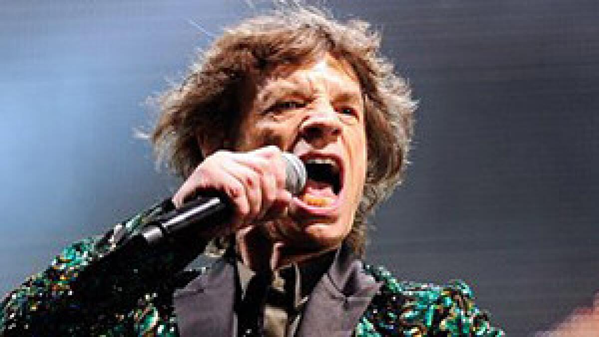 A file picture dated 29 June 2013. shows British Rolling Stones, rock band musician, Mick Jagger performing during their concert at Glastonbury Festival of Contemporary Performing Arts 2013, held at Worthy Farm, near Pilton, Somerset, west England, Britain.