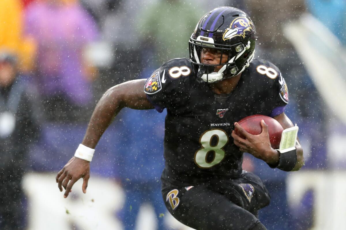 Ravens quarterback Lamar Jackson looks for running room. 