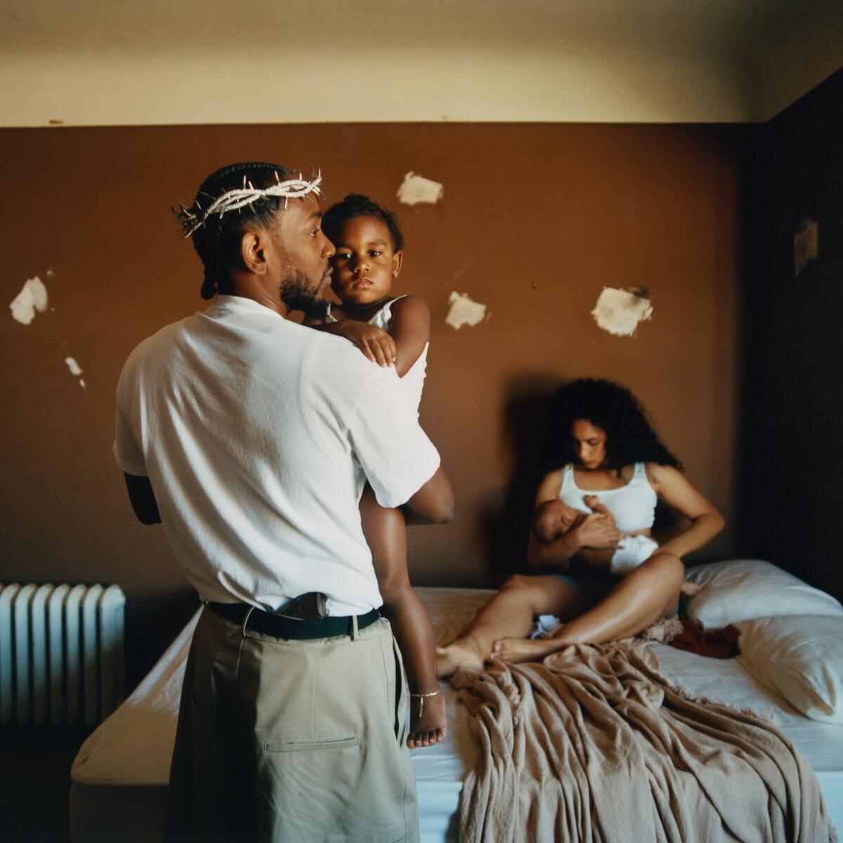 An album cover featuring a man, a woman and their two young children.