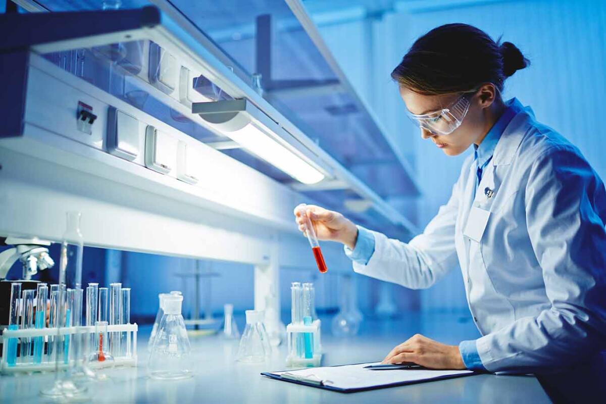 Female scientist in a lab testing substances