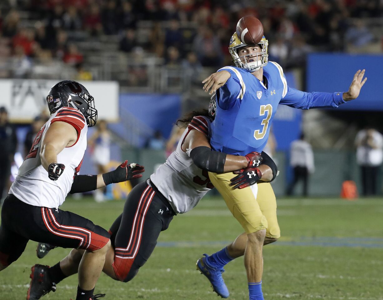UCLA quarterback Wilton Speight, under pressure from the Utah defense, is forced to get rid of the ball in the fourth quarter.