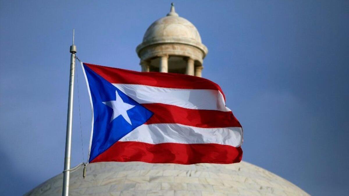 The Puerto Rican flag flies in San Juan in 2015.