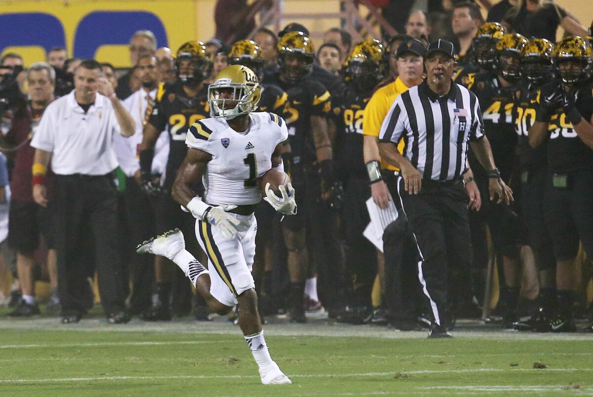UCLA defensive back Ishmael Adams returns a kickoff 100 yards for a touchdown against Arizona State on Sept. 25.