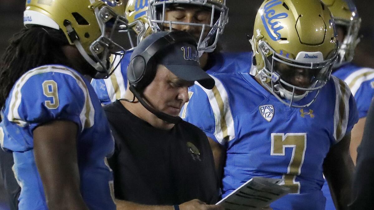 UCLA coach Chip Kelly looks over his play sheet during a game against Fresno State on Sept. 15 at the Rose Bowl.