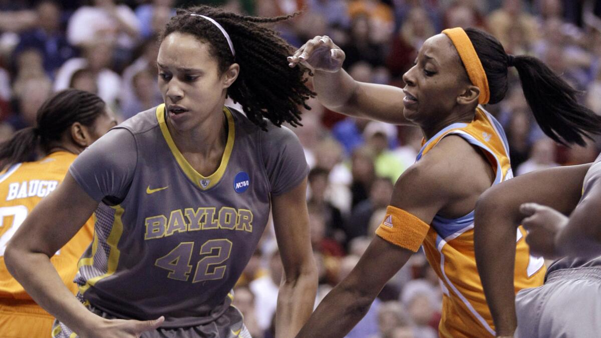 Baylor's Brittney Griner, left, grabs a rebound in front of Tennessee's Glory Johnson during an NCAA tournament regional final in March 2012.