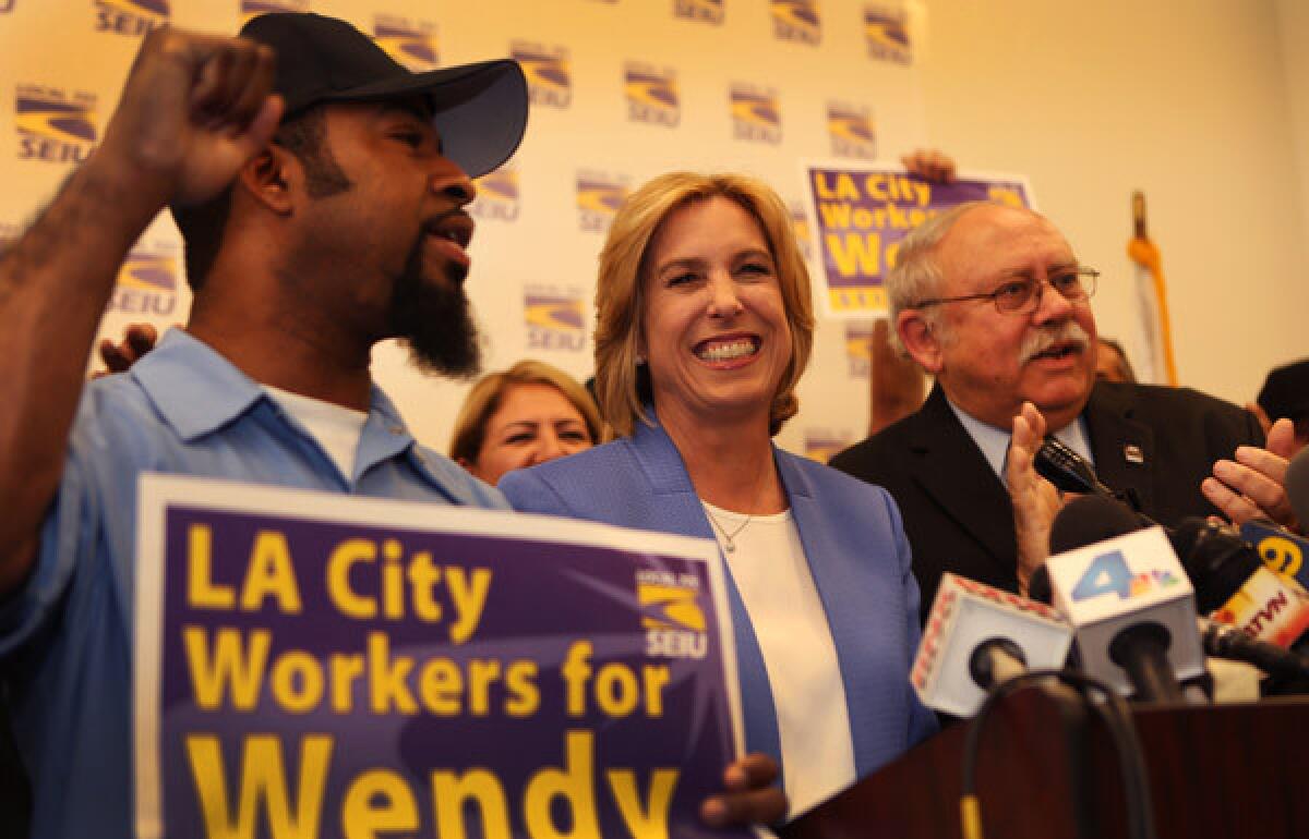 Los Angeles City Controller and mayoral candidate Wendy Greuel, center, receives an endorsement from SEIU Local 721 at the union's headquarters downtown. Now Greuel is in line to receive an endorsement from the powerful L.A. County Federation of Labor.