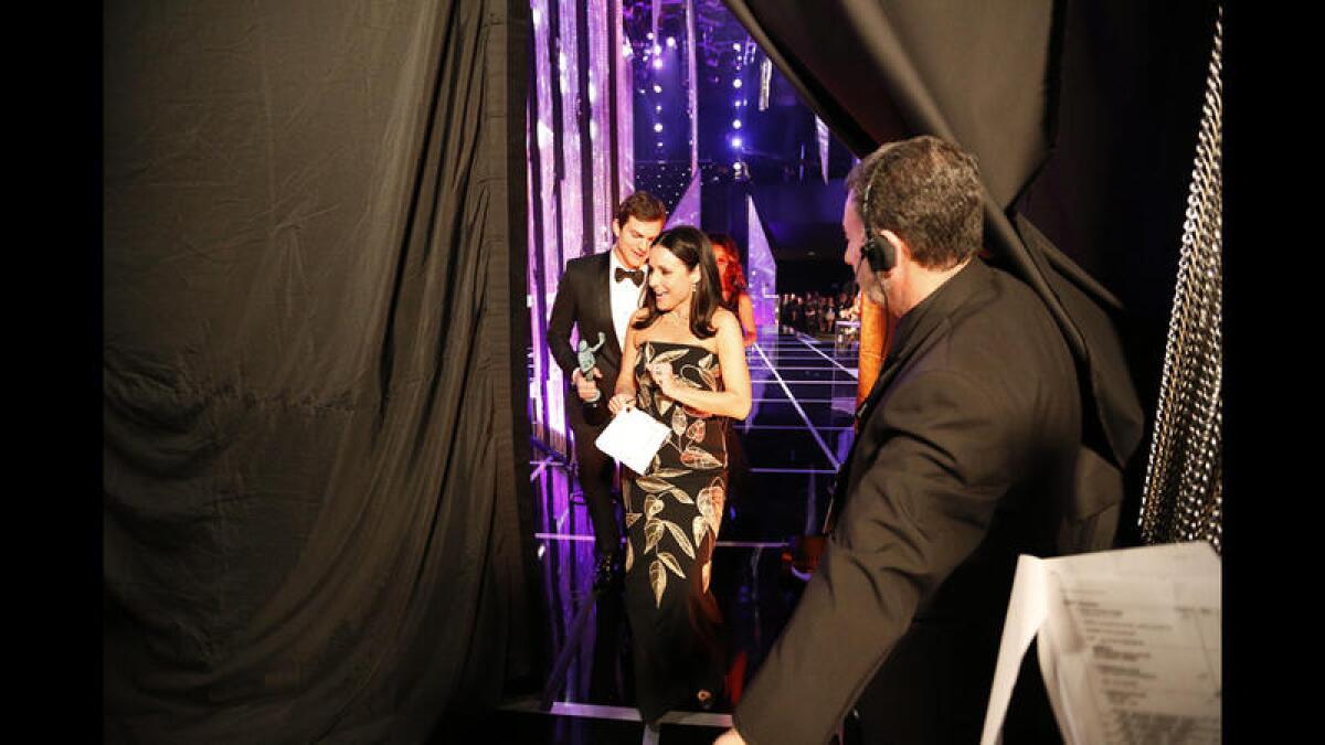 Ashton Kutcher and Julia Louis-Dreyfus backstage at the 23rd Screen Actors Guild Awards.