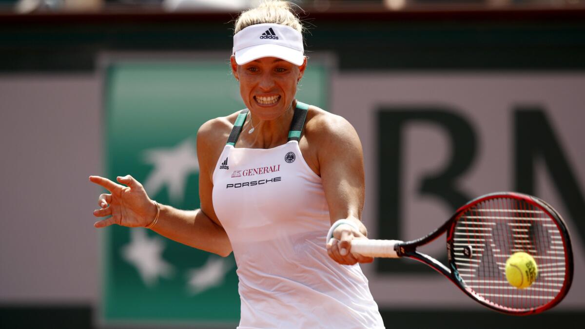 Angelique Kerber of Germany hits a forehand during her first-round loss to Ekaterina Makarova on Sunday at the French Open.