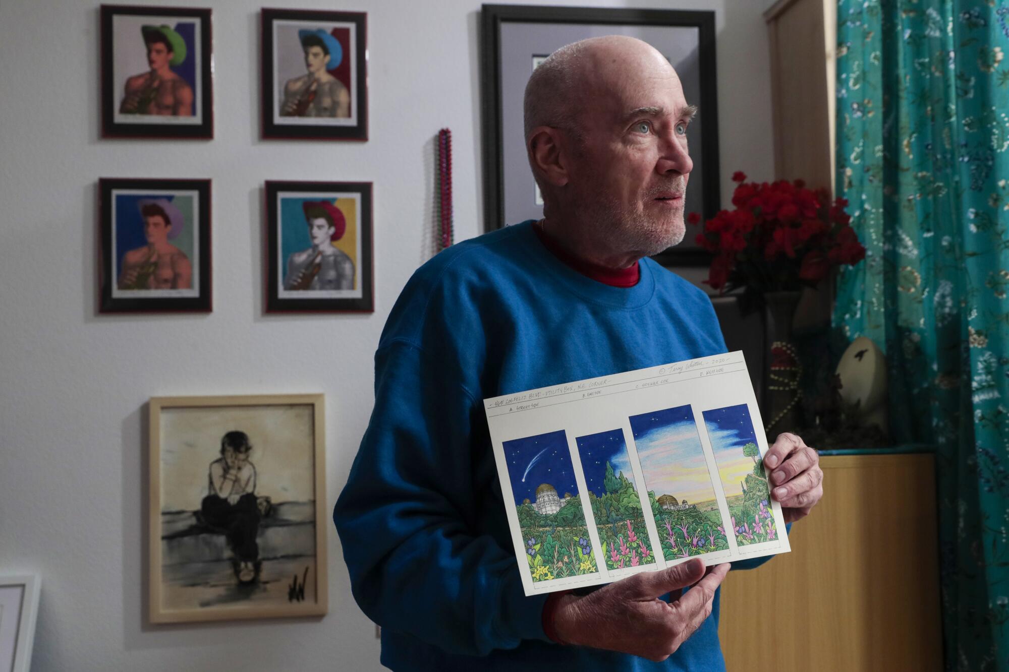 Terrance Whitten at home holds the original rendering of art for a power box 