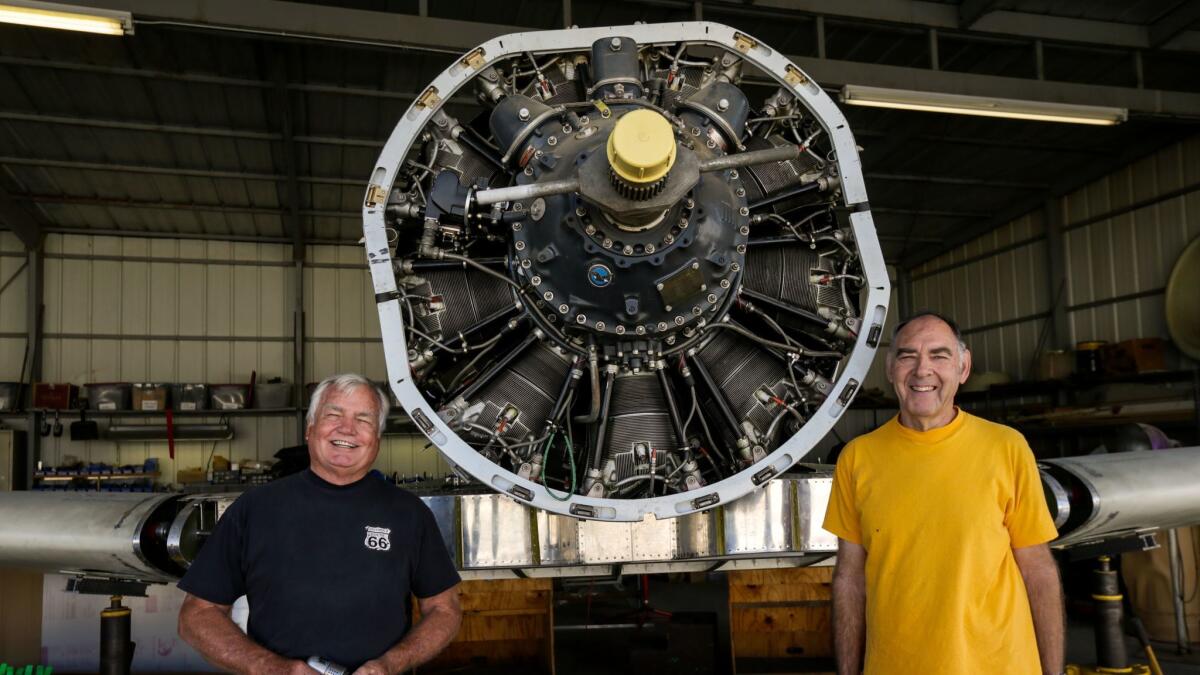 Bill Statler, left, poses for a photo with his friend Dennis Wittman, who is helping Statler build a plane to compete in an air race.