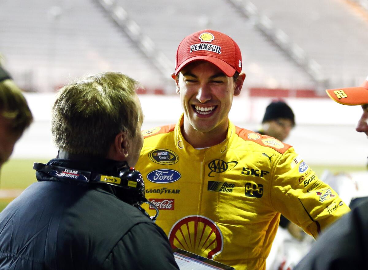 NASCAR driver Joey Logano is all smiles after winning the pole for Sunday's Sprint Cup race.