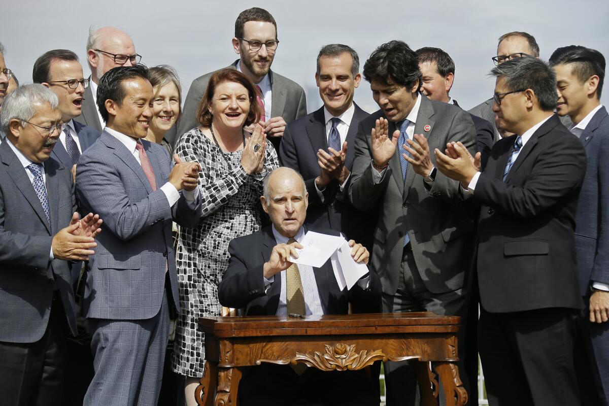 Gov. Jerry Brown signed a package of bills aimed at tackling California's affordable housing crisis.