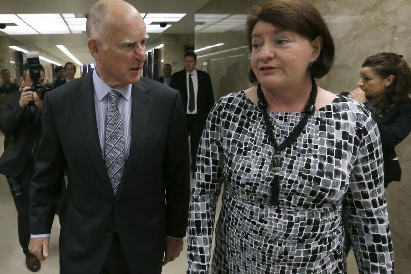 Gov. Jerry Brown and Assembly Speaker Toni Atkins, of San Diego return to Brown's office after a news conference where he and other Legislative leaders unveiled a proposed $1 billion package of emergency drought-relief legislation at the Capitol in Sacramento, Calif., Thursday, March 19, 2015. The proposal accelerates spending already approved by voters for water and flood projects. It includes money for emergency drinking water, food aid for the hardest-hit counties, fish and wildlife protections and groundwater management.(AP Photo/Rich Pedroncelli)