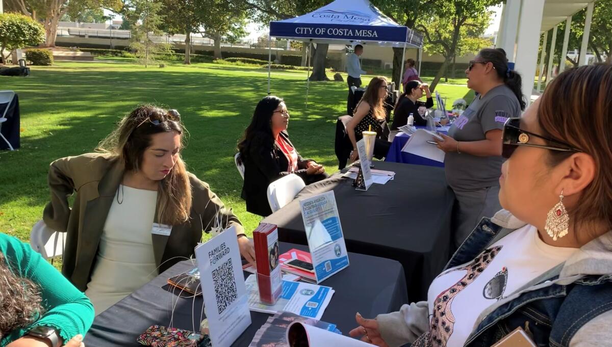 Costa Mesa staff answer questions  about rental assistance and help residents enroll in available programs.